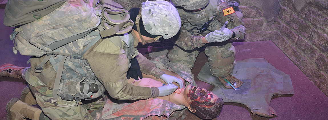 Combat Medic Specialist administering aid 2